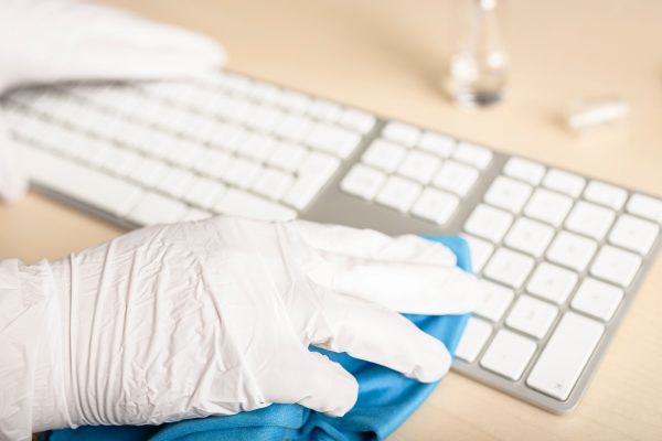 hand-with-gloves-cleaning-a-keyboard-with-disinfectant.jpg hand-with-gloves-cleaning-a-keyboard-with-disinfectant.jpg